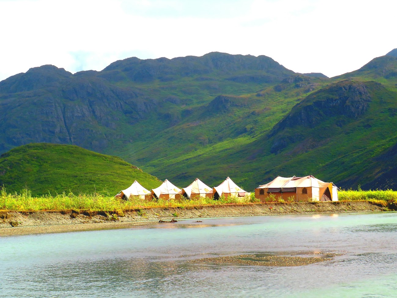 Camp and green mountains